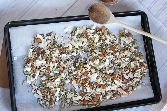 coconut, almonds and seeds on a baking sheet