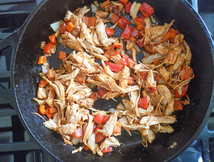 Chicken, peppers, onions in a pan