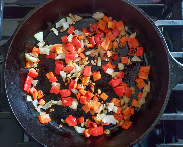 peppers and onions in a skillet