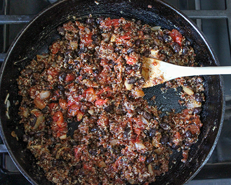 all of the taco filling mixed together in a pan.