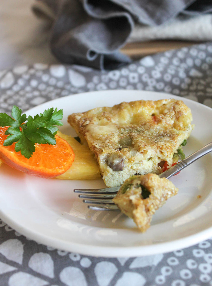 a piece of breakfast pie on a plate with a fork