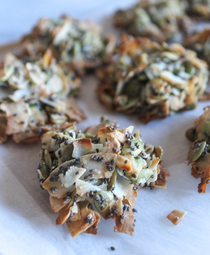 A close up coconut clusters on parchment paper