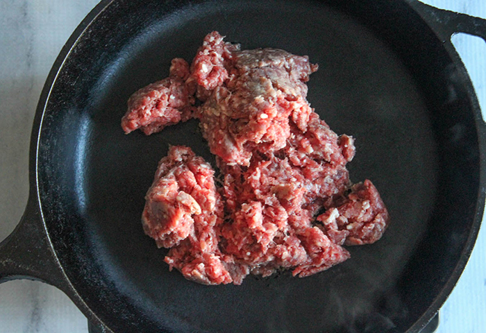 a picture of ground beef cooking in a skillet