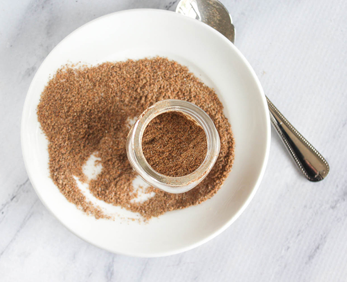 an overhead view of a jar with the mixed taco seasoning