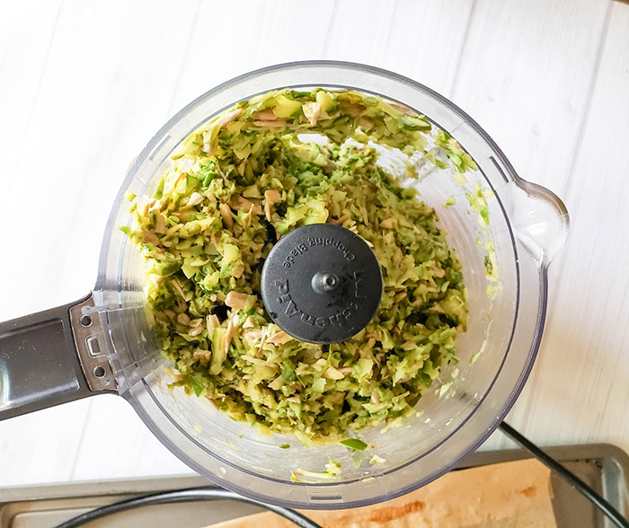 processed asparagus, garlic and sunflower seeds in a food processor