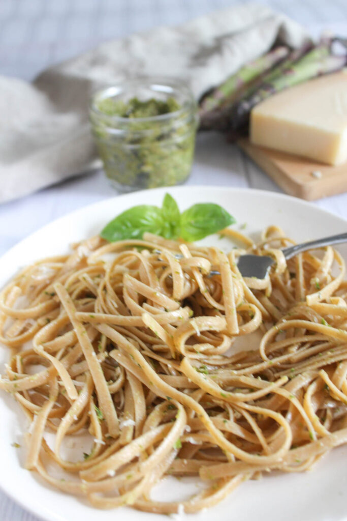 asparagus pesto on a plate with a fork