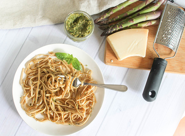 an overhead view of pesto on a white plate