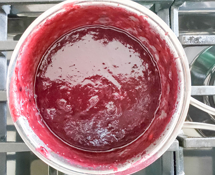 a picture of pureed blueberry bbq sauce in a pan