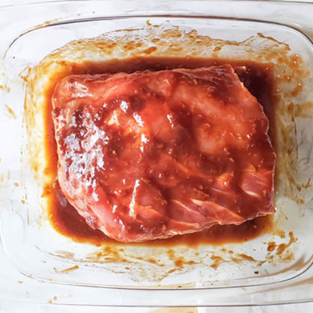 pork marinating in a glass dish, process 2 