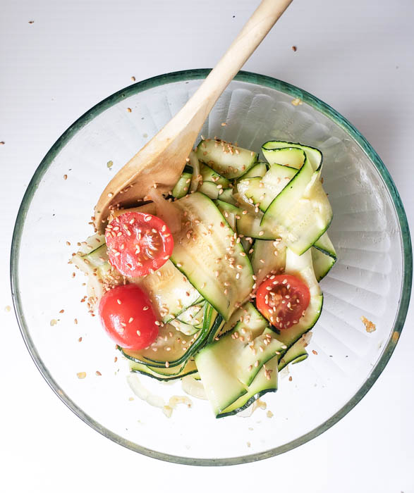 an overhead view of the completed zucchini ribbon salad in a bowl