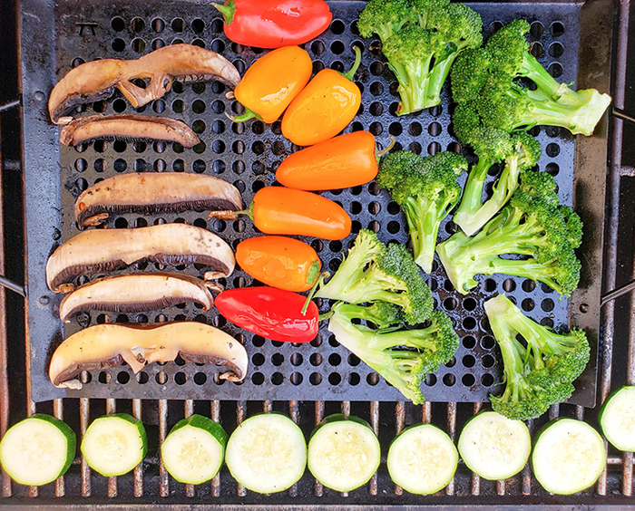 a picture of vegetables cooking on a grill