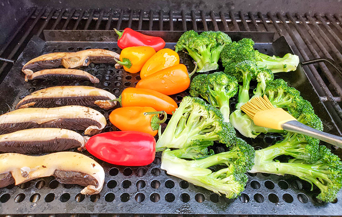 Vegetables on the grill with basting brush