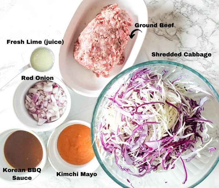 The taco ingredients: Korean BBQ sace, Kimchi Mayo, Shredded Cabbage, Onion, lime juice, ground beef