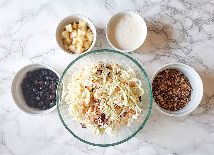 an overhead view of apple slaw ingredients