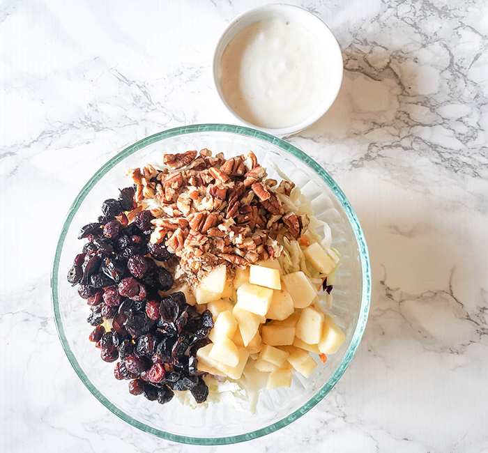 apple slaw ingredients in a bowl