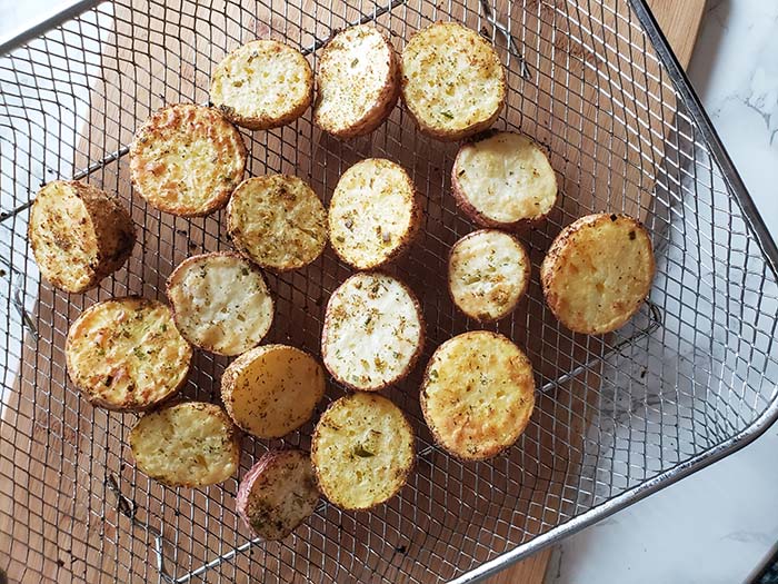 air fryer potatoes cooked on air fryer tray