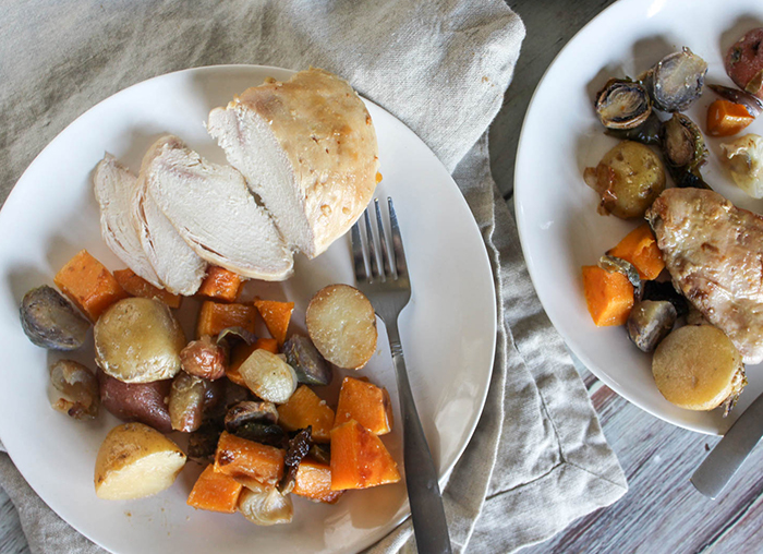 an overhead view of the chicken on a plate with avegetables an da fork