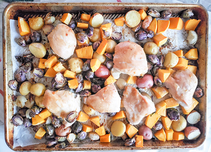 an overhead view of the roasted chicken pieces on the sheet pan