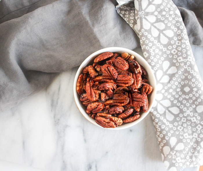 an overhead view of sweet and spicy pecans in a bowl