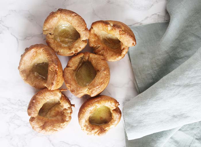 an overhead view of Yorkshire puddings on a tray