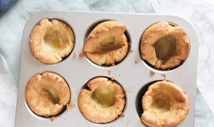 an overhead view of cooked yorkshire puddings