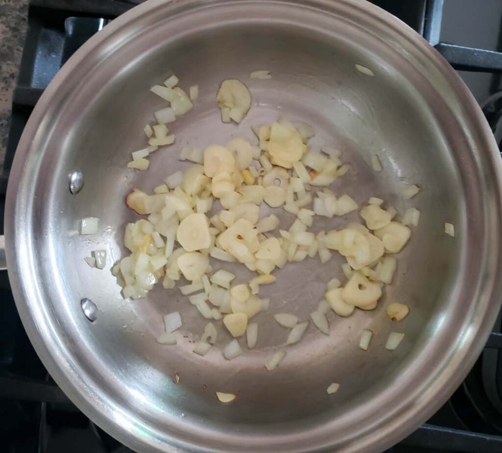 blush sauce garlic and onions in pan