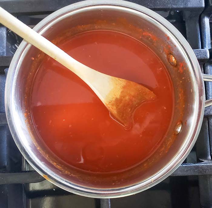 strained jalapeno peppers in a pan 