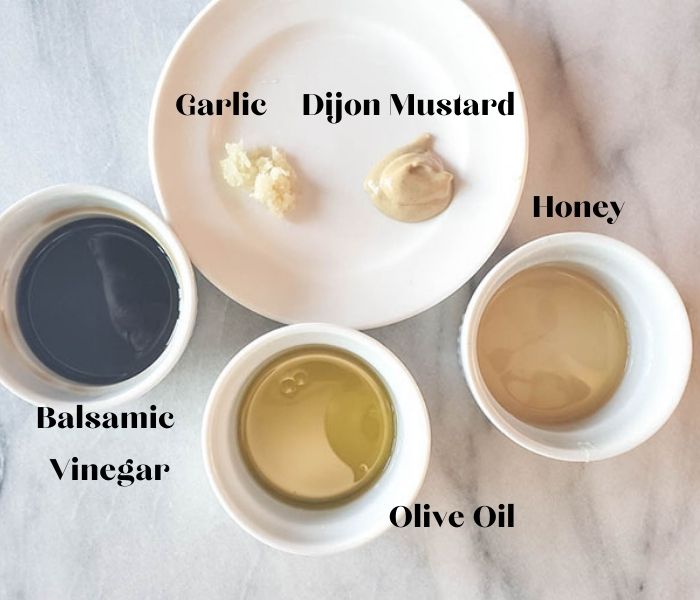 salad dressing ingredients: garlic, dijon mustard, honey, balsamic vinegar, olive oil