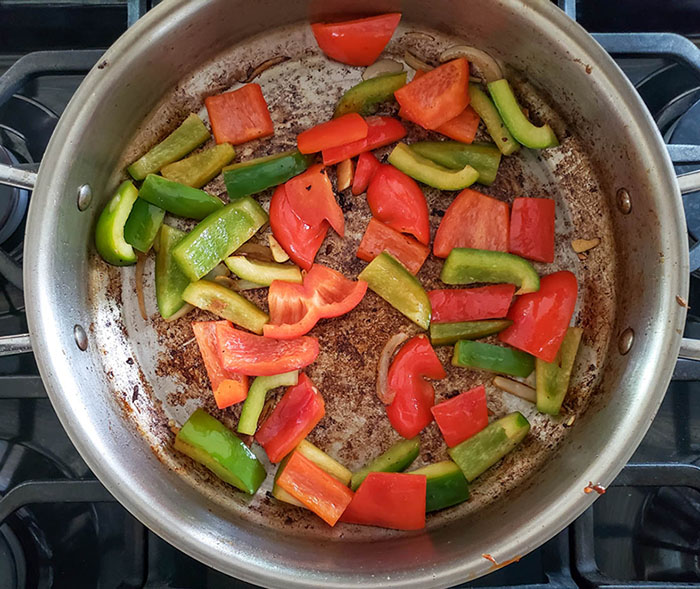 peppers cooking in a skillet