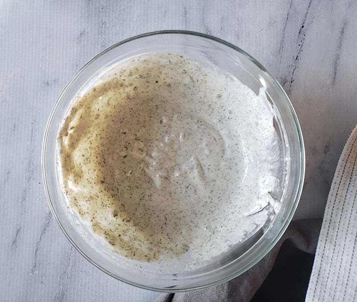 a view of the dressing in a mixing bowl all mixed together