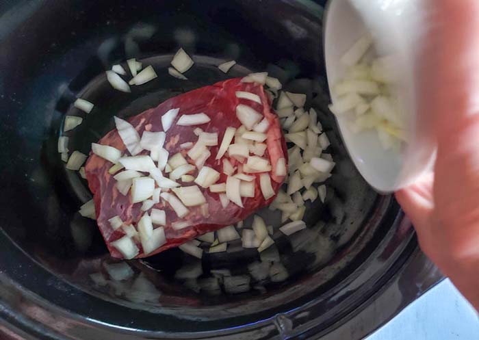 tri tip roast in crock pot with onions