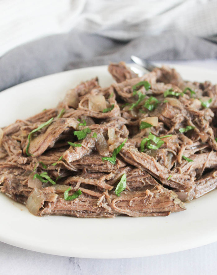 a plate of shredded beef on a platter