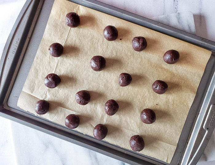 rolled bourbon balls on a tray