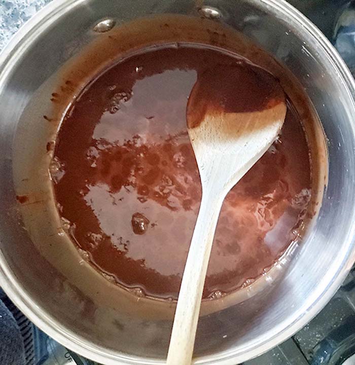 a saucepan with melted chocolate