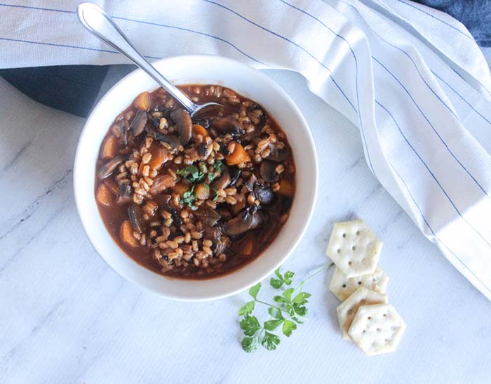 overhead view of mushroom barley soup in a bowl