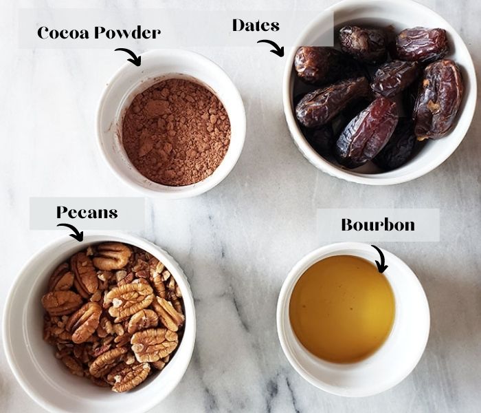 bourbon balls ingredients: pecans, bourbon, dates, cocoa powder