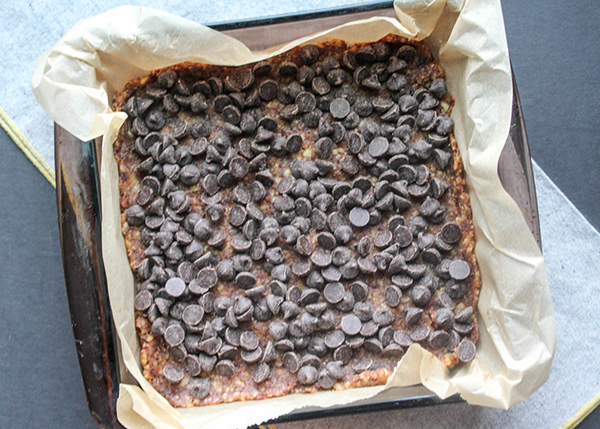 chocolate chips on top of date dough