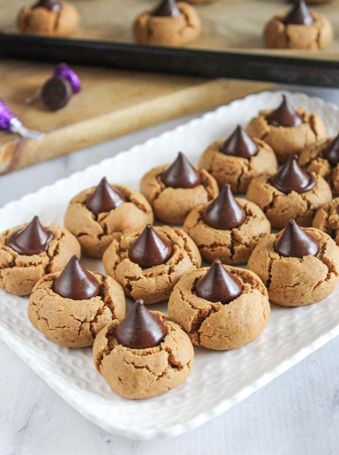 Closeup image of Peanut Butter Blossoms Cookies on a serving tray ready to eat.