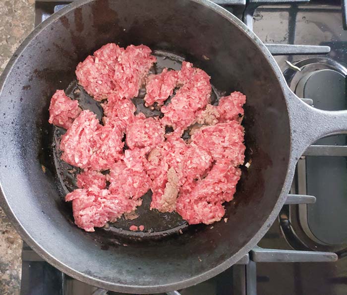 ground beef cooking in a skillet