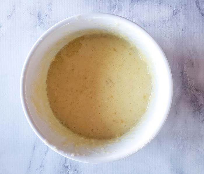 liquid ingredients mixed in white bowl