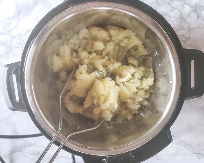 Mashed potatoes in the instant pot with a potato masher