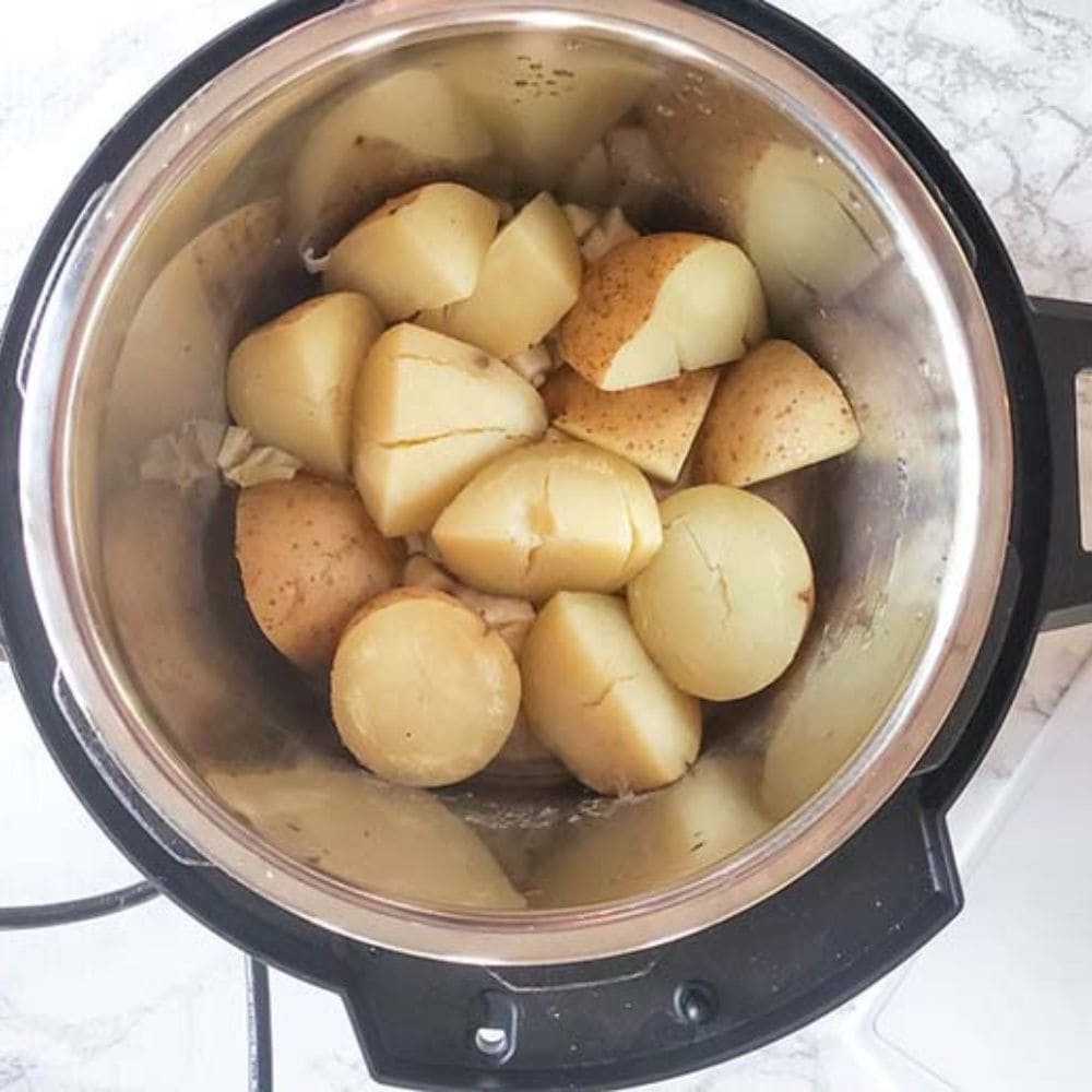 instant pot mashed potatoes step 2 cooked potato chunks in an instan pot