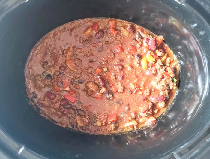 chili ingredients mixed together in a crock pot