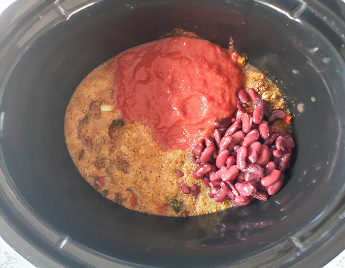 beer tomatoes and beans in a crock pot for chili