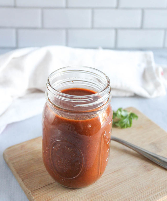 homemade enchilada sauce in a jar