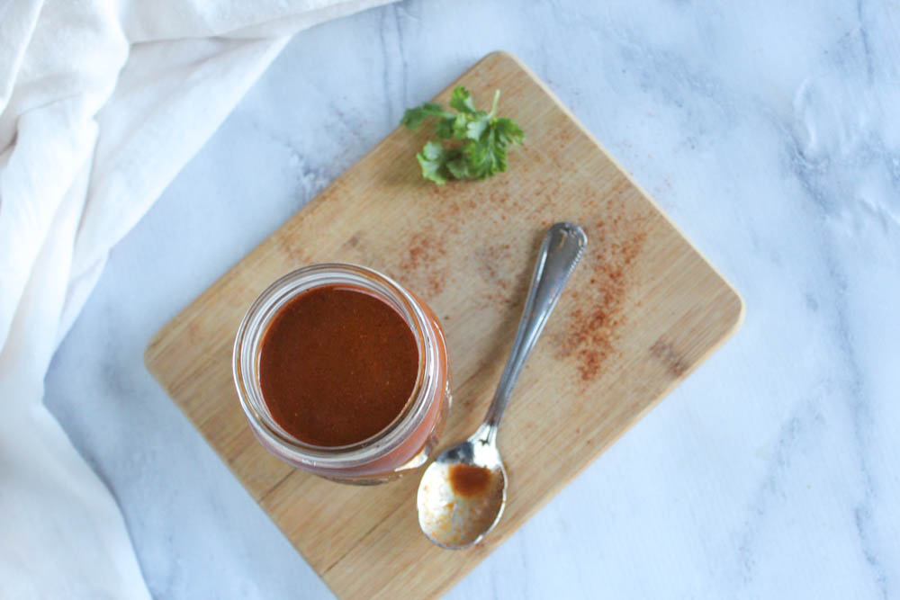 overhead view of enchilada sauce in a jar