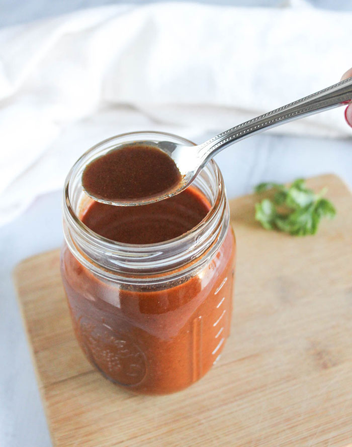 enchilada sauce with a spoon