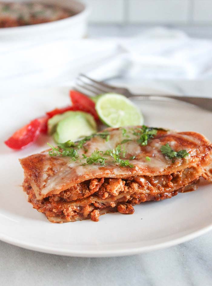 a slice of enchilada casserole on a plate