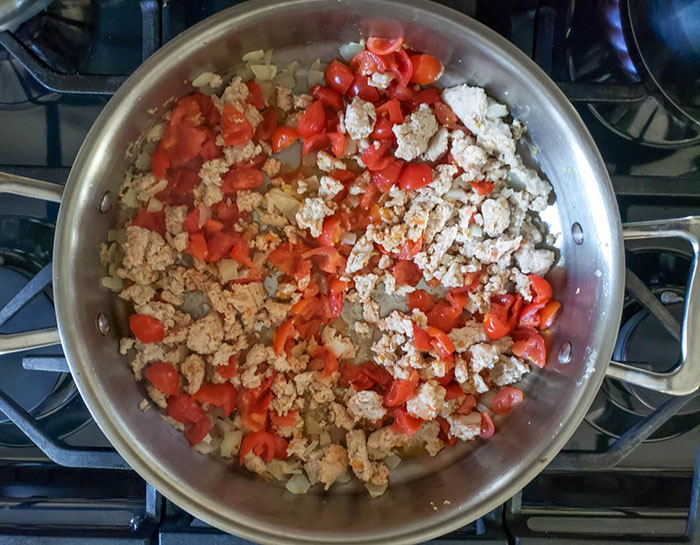Chicken tomatoes in skillet