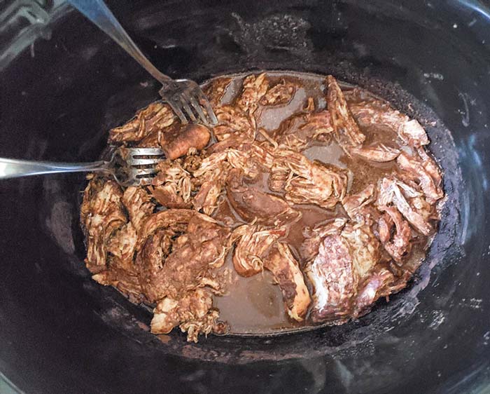 shredded chicken in a slow cooker